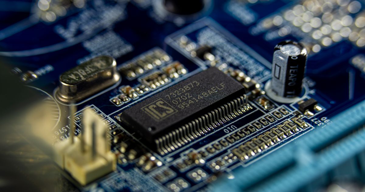Close-up of a blue circuit board — the physical hardware AI runs on
